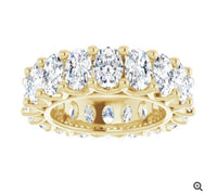 The Karat Concierge oval lab grown diamond eternity band in yellow gold with FG color VS clarity stones.