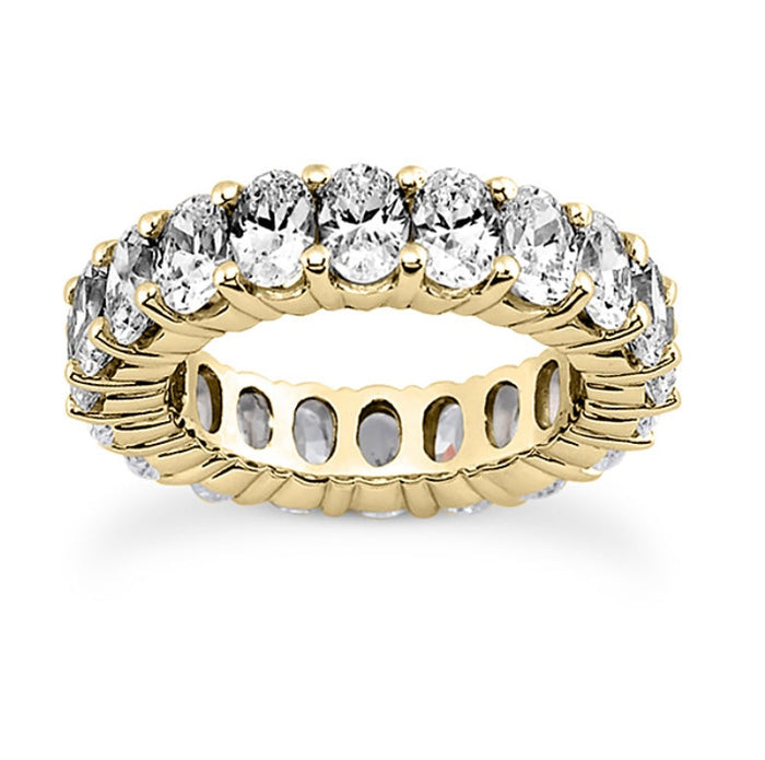 The Karat Concierge oval lab grown diamond eternity band in yellow gold with FG color VS clarity stones.