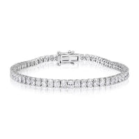 The Karat Concierge 14K white gold tennis bracelet featuring oval-cut diamonds set north to south with safety latches.