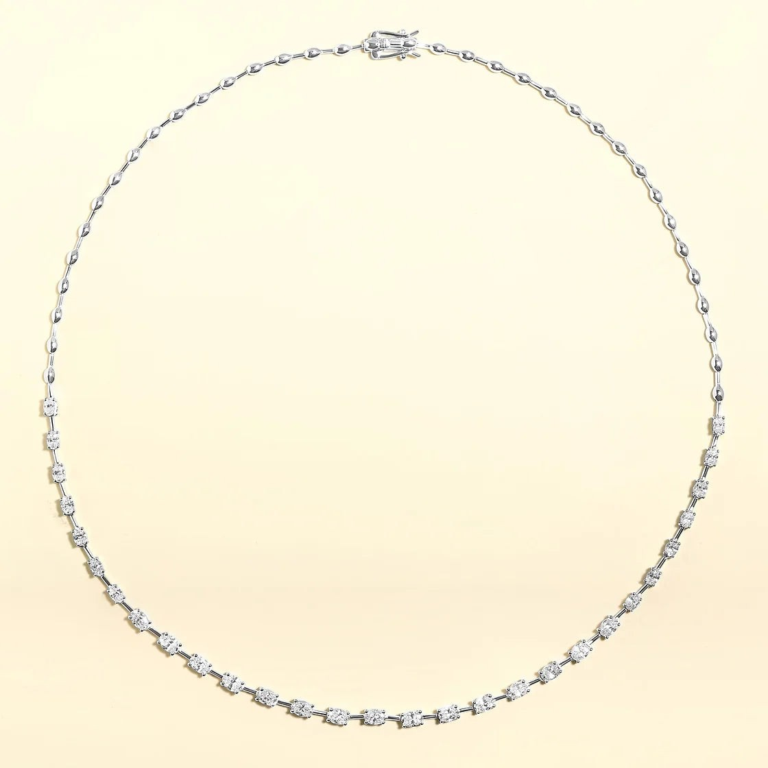 The Karat Concierge Madyson oval tennis necklace in 14K white gold with 3.7 carat oval diamonds and beaded chain.