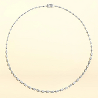 The Karat Concierge Madyson oval tennis necklace in 14K white gold with 3.7 carat oval diamonds and beaded chain.