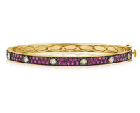The Karat Concierge Pave Muse bangle in yellow gold with pink pavé gemstones and bezel-set diamonds.