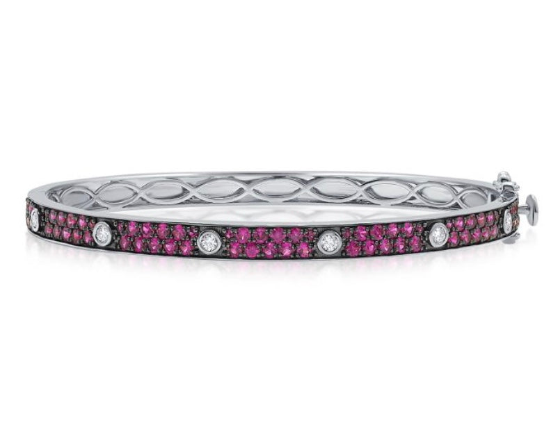 The Karat Concierge Pave Muse bangle in white gold with pink pavé gemstones and bezel-set diamonds.