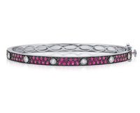 The Karat Concierge Pave Muse bangle in white gold with pink pavé gemstones and bezel-set diamonds.