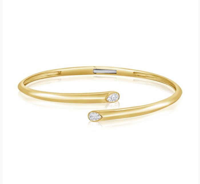 The Karat Concierge 14K yellow gold hinged cuff bangle featuring two bezel-set pear-shaped diamonds.