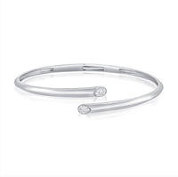 The Karat Concierge hinged cuff bangle in white gold featuring two pear-shaped bezel set diamonds.