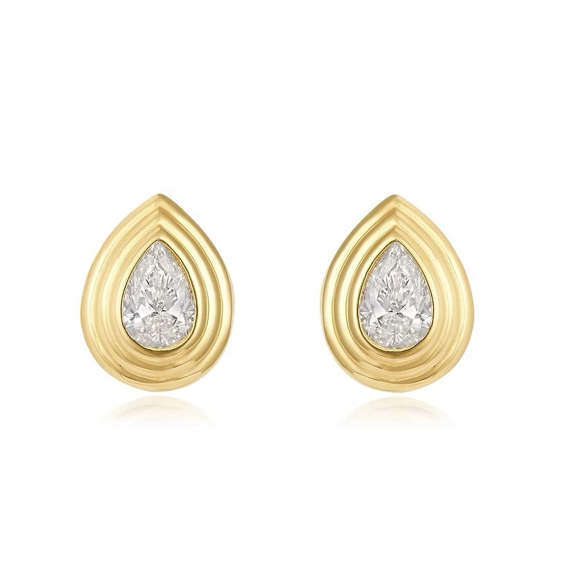 The Karat Concierge Gatsby Stud earrings featuring pear-cut diamonds in 14K yellow gold faceted bezel settings.