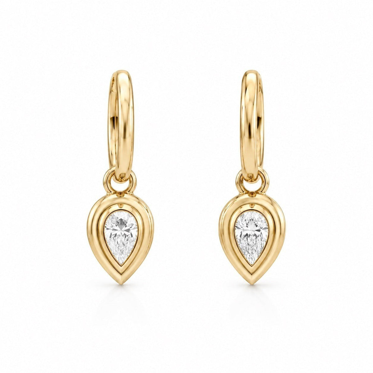The Karat Concierge Gatsby Pear Huggies in 14K yellow gold with pear-shaped natural diamond bezels.