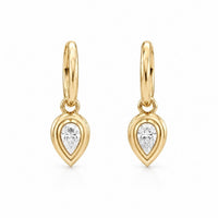 The Karat Concierge Gatsby Pear Huggies in 14K yellow gold with pear-shaped natural diamond bezels.