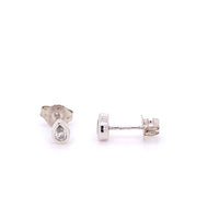 The Karat Concierge pear shaped diamond stud earrings in 14K white gold with a dainty bezel setting