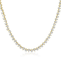 The Karat Concierge Meridian tennis necklace featuring pear-shaped diamonds set in 14K yellow gold.