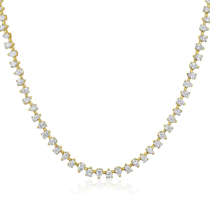 The Karat Concierge Meridian tennis necklace featuring pear-shaped diamonds set in 14K yellow gold.