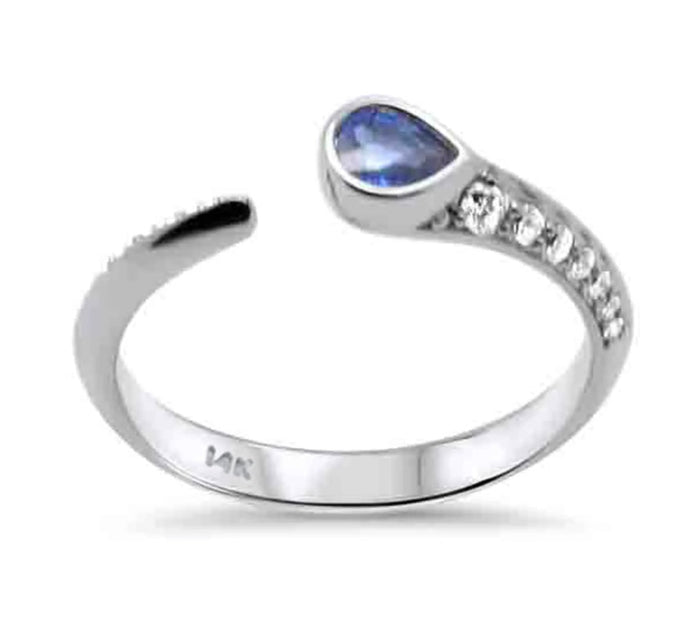 The Karat Concierge 14K white gold wrap ring featuring a pear-shaped blue sapphire and shimmering diamond accents.