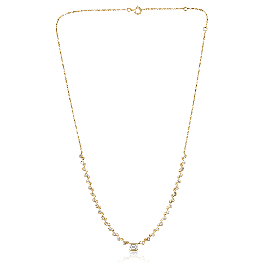 The Karat Concierge Peyton necklace featuring a bezel set emerald cut diamond and round diamonds in 14K yellow gold.