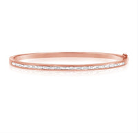 The Karat Concierge rose gold bangle featuring a channel set row of sparkling baguette diamonds.