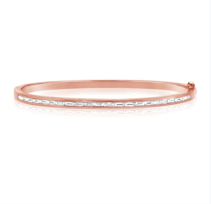The Karat Concierge rose gold bangle featuring a channel set row of sparkling baguette diamonds.