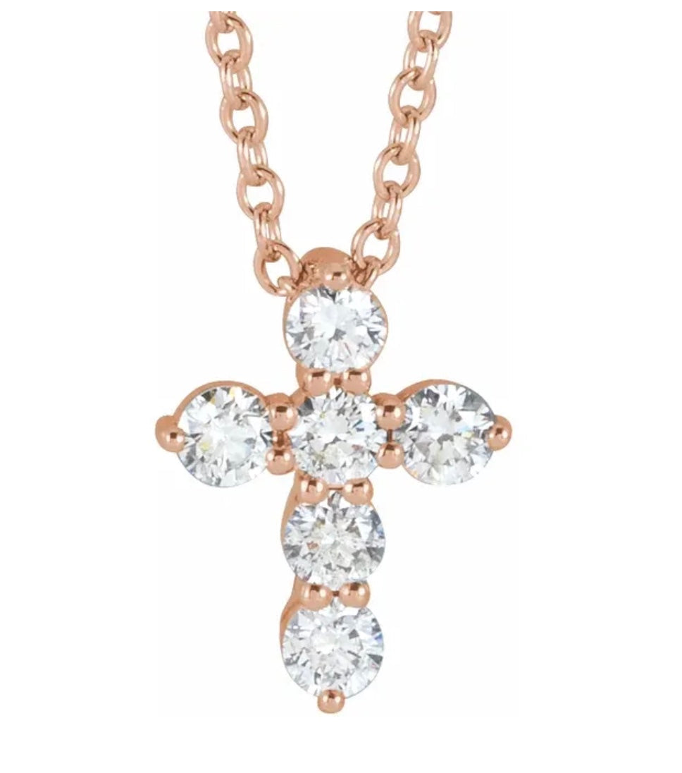 The Karat Concierge rose gold cross pendant necklace featuring five brilliant-cut diamonds on a delicate chain.