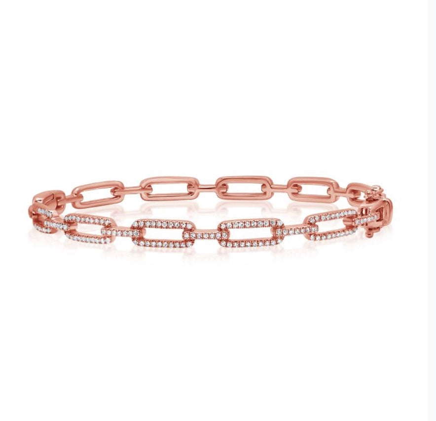 The Karat Concierge diamond link bangle in 14K rose gold with .54 CTW pavé diamonds and a double latch closure.