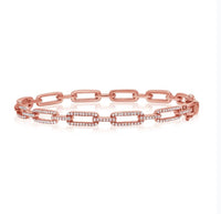 The Karat Concierge diamond link bangle in 14K rose gold with .54 CTW pavé diamonds and a double latch closure.
