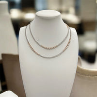 The Karat Concierge Rose Riviera 32-inch tennis necklace featuring 14K white and rose gold with 13 carats of diamonds.