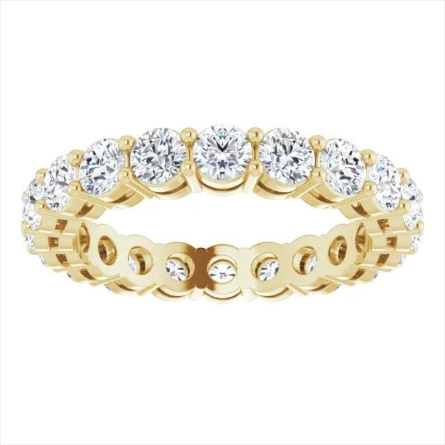 The Karat Concierge round diamond eternity band in 14K yellow gold with a two-prong setting for maximum brilliance.