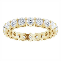 The Karat Concierge round diamond eternity band in 14K yellow gold with a two-prong setting for maximum brilliance.