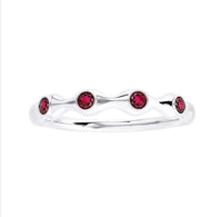 The Karat Concierge bamboo-style ring in 18K gold featuring four round red ruby gemstones in a delicate stackable band.