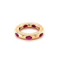 The Karat Concierge 14KT yellow gold donut ring featuring oval-cut rubies in a sleek, whimsical stackable design.