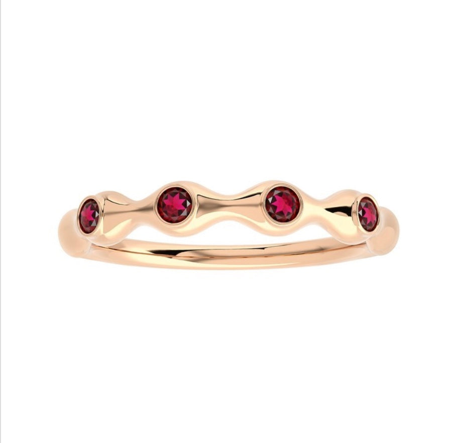 The Karat Concierge 18K gold bamboo-style ring featuring four round ruby gemstones in a delicate stackable design.