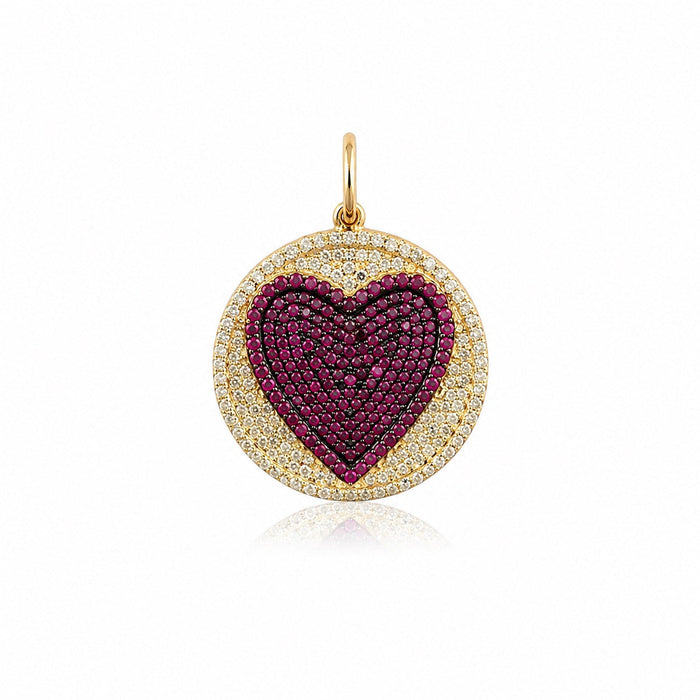 The Karat Concierge round pendant featuring a pavé ruby heart surrounded by sparkling diamonds in 14K yellow gold.