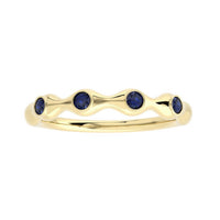 The Karat Concierge 18K gold bamboo ring featuring four round blue sapphire gemstones in a stackable design.