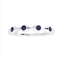 The Karat Concierge sapphire bamboo ring featuring four round blue gemstones set in a polished silver-tone band.