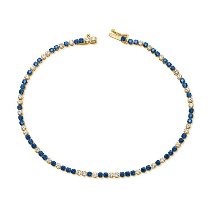 The Karat Concierge tennis bracelet featuring alternating blue sapphires and white diamonds set in 14K yellow gold.
