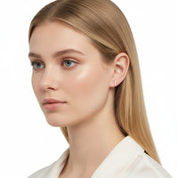 The Karat Concierge trio stud earrings with three round diamonds in a shared prong setting worn by a blonde model