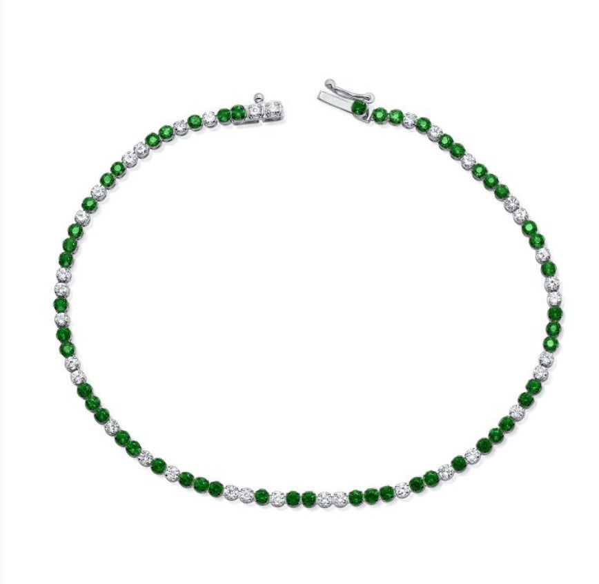 The Karat Concierge tennis bracelet featuring alternating green tsavorite gemstones and brilliant white diamonds.