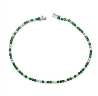 The Karat Concierge tennis bracelet featuring alternating green tsavorite gemstones and brilliant white diamonds.