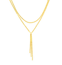 The Karat Concierge Valentino lariat necklace in gold featuring a 2.7mm chain with a sliding bolo and tassel drop.