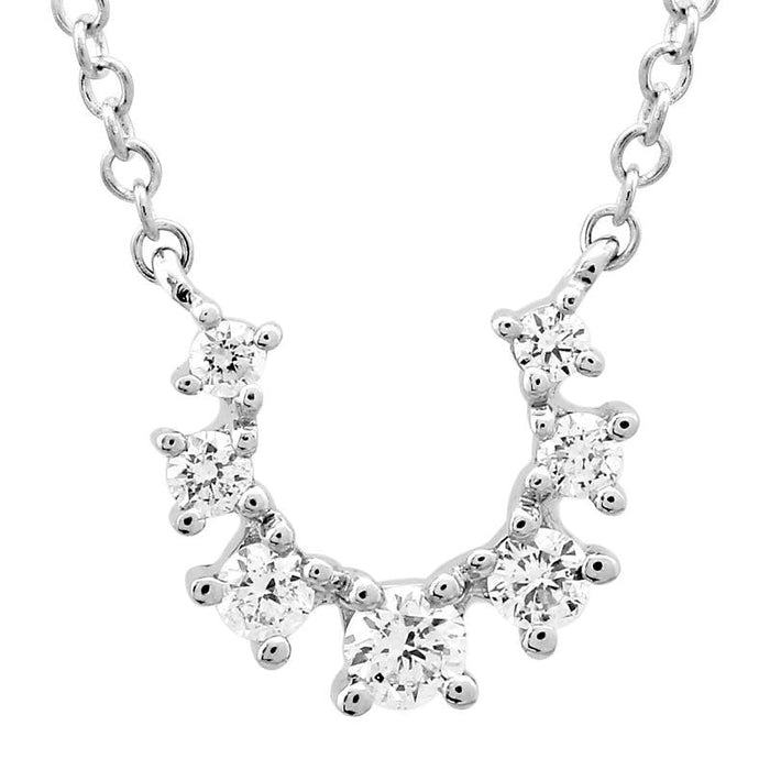 The Karat Concierge white gold horseshoe necklace featuring seven graduated sparkling diamonds on a delicate chain.