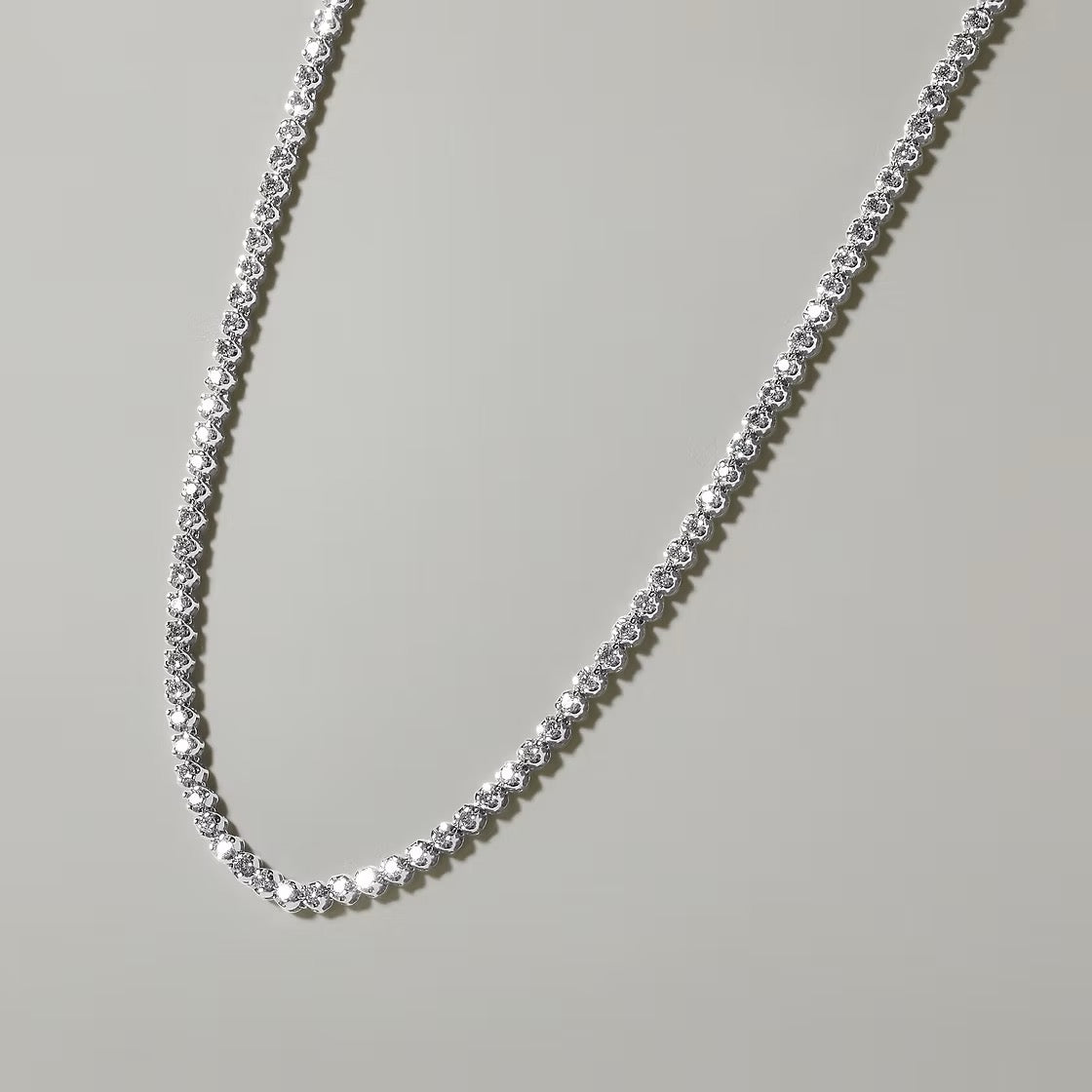The Karat Concierge 14K white gold tennis necklace featuring 2 CTW crown set diamonds in a delicate 16-inch design.