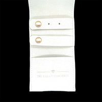 The Karat Concierge white mini travel jewelry case with earring tabs and necklace pocket for organized storage.