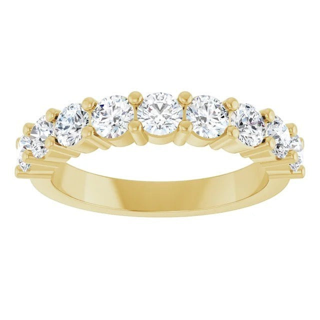 The Karat Concierge round diamond halfway band in 14K yellow gold with a shared prong setting.