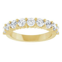 The Karat Concierge round diamond halfway band in 14K yellow gold with a shared prong setting.