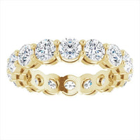 The Karat Concierge round diamond eternity band in 14K yellow gold with a two-prong setting for maximum brilliance.
