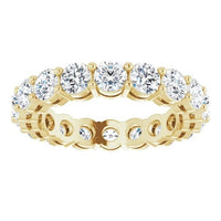 The Karat Concierge round diamond eternity band in 14K yellow gold with a two-prong setting and gallery view.