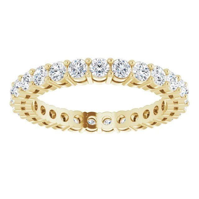 The Karat Concierge round diamond eternity band in 14K yellow gold with a sophisticated 2-prong setting.