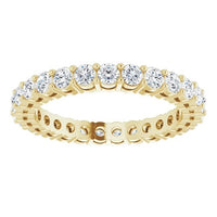 The Karat Concierge round diamond eternity band in 14K yellow gold with a sophisticated 2-prong setting.