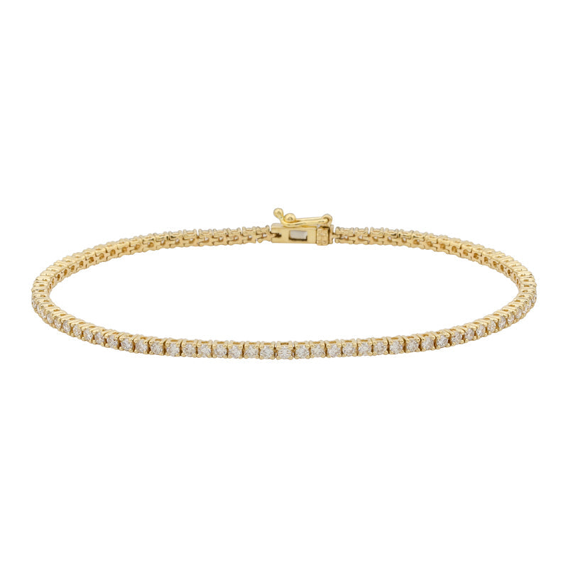 The Karat Concierge 14K yellow gold tennis bracelet featuring a 4-prong diamond setting and a secure double latch.