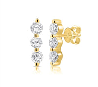 The Karat Concierge 14K yellow gold trio bar earrings featuring three round diamonds with secure tension backs.