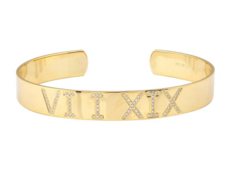 Roman numerals in a custom Cuff Bracelet set with diamonds yellow gold